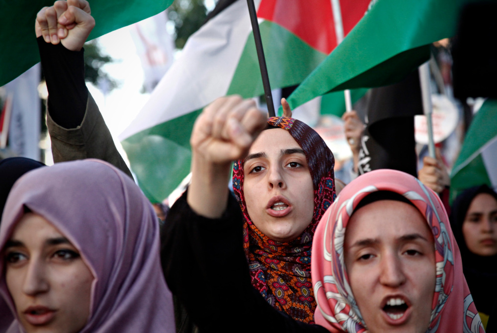a group of women Palestinian activist at a rally