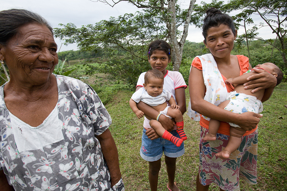 a group of five women ranging an age from infant to elderly