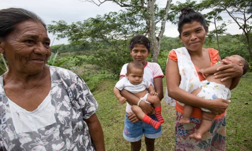 a group of five women ranging an age from infant to elderly