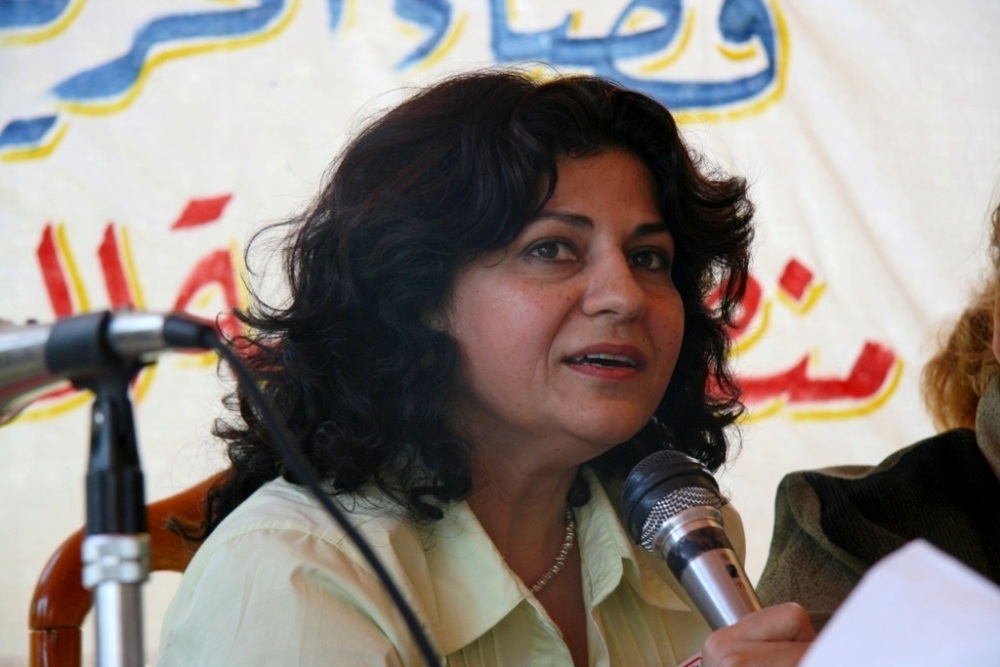 Yanar Mohammed speaks into a microphone during an event.